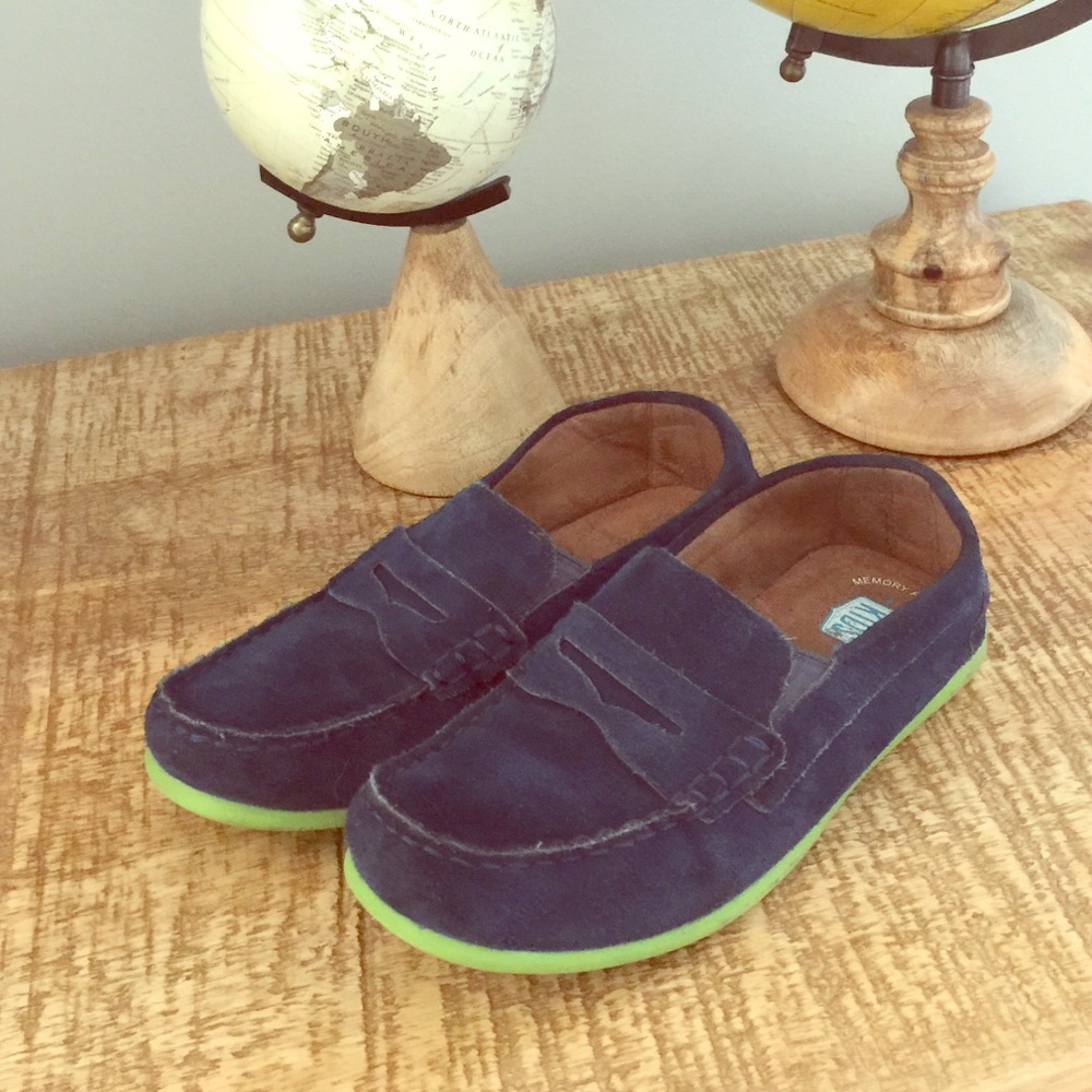 Navy blue suede loafers with green rubber soles